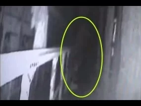 Eastern State Prison ghost video. Is it a man wearing a cape and tennis shoes and not a ghost?