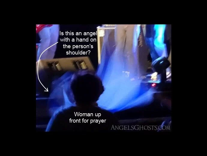 Is this angel praying for a person?