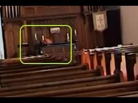 Watch closely at about the 0:21 mark just to the left of the altar...