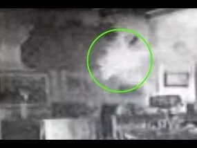 At about :05 in, a light pops in the center of the room. Very cool ghost phenomenon!