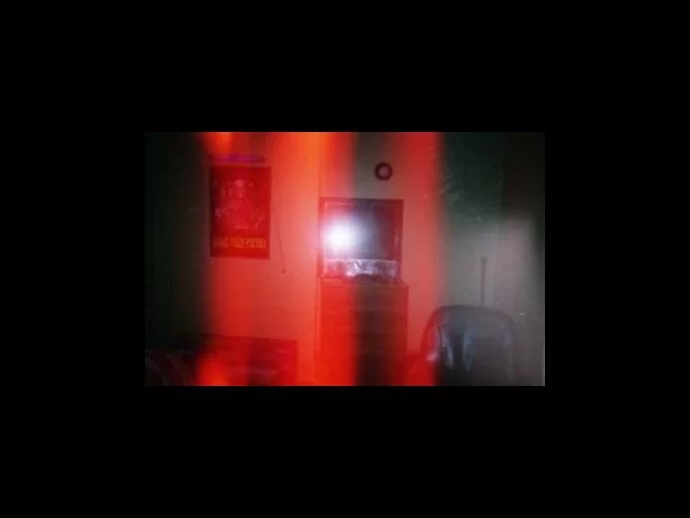 Photo of red anomalies on film from a ghostly presence, perhaps?