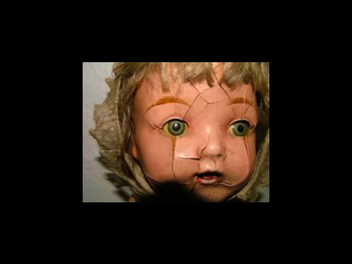 The face of the doll that is said to have ghosts.