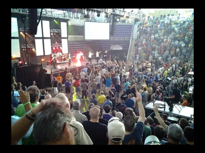 Promise Keepers event has a light form appear on stage in this photo...