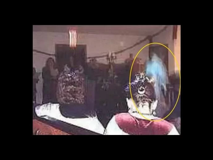 Apparition appears among attendees of a religious service. Is it an angel or the apparition of Mary, or maybe a saint?